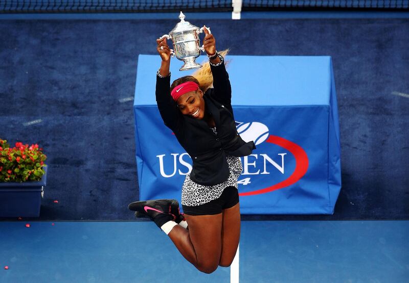 NEW YORK, NY - SEPTEMBER 07:  Serena Williams of the United States celebrates with the trophy after defeating Caroline Wozniacki of Denmark to win their women's singles final match on Day fourteen of the 2014 US Open at the USTA Billie Jean King National Tennis Center on September 7, 2014 in the Flushing neighborhood of the Queens borough of New York City. Williams defeated Wozniacki in two sets by a score of 6-3, 6-3.  (Photo by Streeter Lecka/Getty Images)