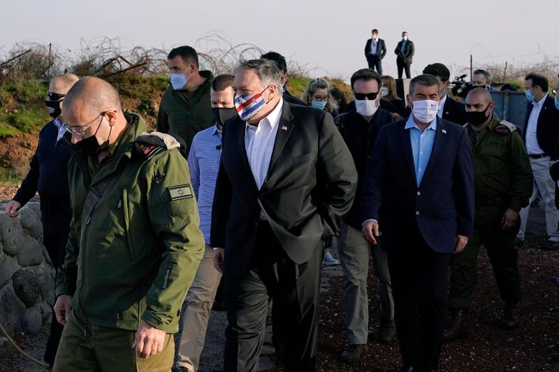 US Secretary of State Mike Pompeo, center, arrives for a security briefing on Mount Bental. AP Photo