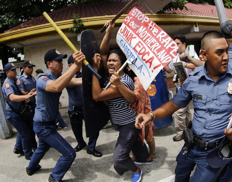 Filipino activists scuffle with police on September 16, 2016, during a protest in front of the US embassy in Manila, Philippines. They were showing support for president Rodrigo Duterte’s remarks on September 12, that he wants US forces out of southern Philippines, blaming Washington for the ongoing conflict in the region, as well as the killing of Muslim Filipinos during the US pacification campaign in the early 1900s. Francis R. Malasig / EPA