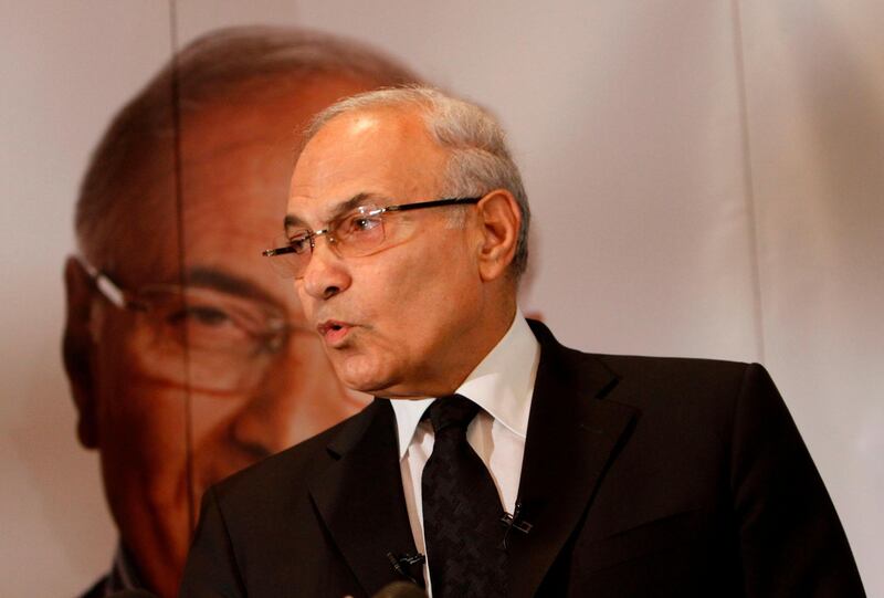 (FILES) This file photo taken on June 03, 2012 shows former Egyptian prime minister Ahmed Shafiq addressing a press conference in Cairo. 
Former Egyptian premier Ahmed Shafiq, who narrowly lost a 2012 election to a since ousted Islamist president, will challenge leader Abdel Fattah al-Sisi at a poll next year, two aides told AFP. "I can confirm he will run," one of them said of the Hosni Mubarak-era prime minister who left the country in 2012 for the United Arab Emirates. 
 / AFP PHOTO / MOHAMMED ABED