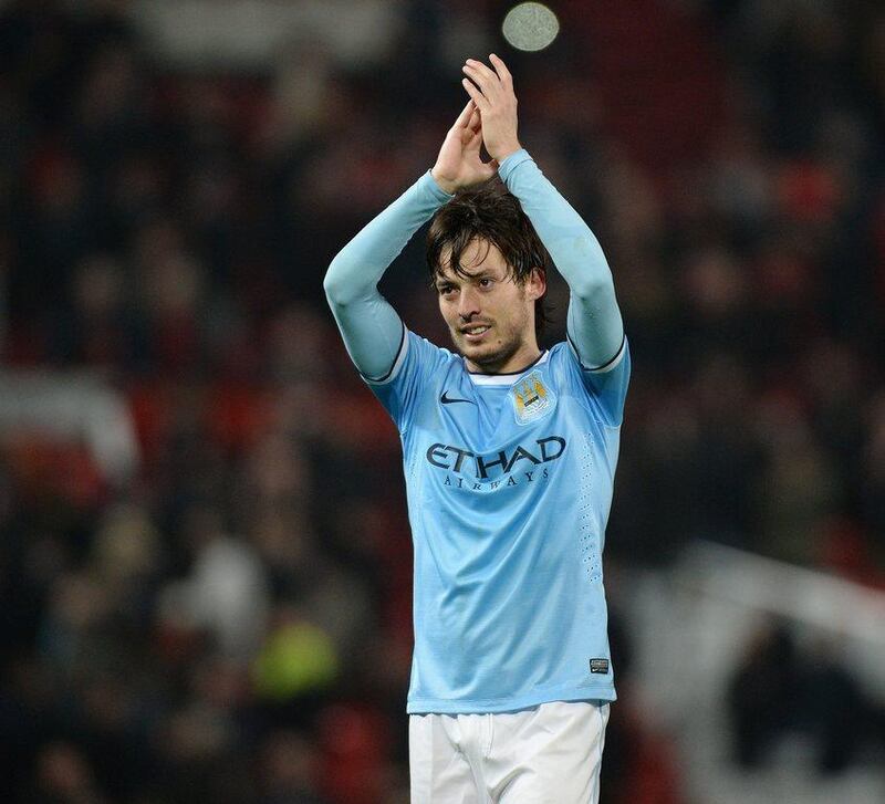 Manchester City midfielder David Silva celebrates after their 3-0 victory on Tuesday. Peter Powell / EPA / March 25, 2014