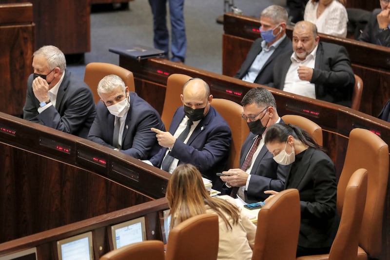 Israeli Prime Minister Naftali Bennett, centre, Defence Minister Benny Gantz, Foreign Minister Yair Lapid and other officials attend a vote in the Knesset. Senior officials said Iran’s nuclear programme – under discussion in Vienna – is of major concern to Israel and have suggested a military response could be on the table. AFP