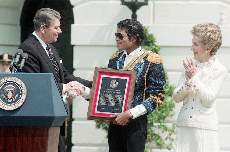 After lending his hit song 'Beat It' to a campaign against drink driving, Michael Jackson was rewarded with a Presidential Special Achievement Award by President Ronald Reagan in 1984. Getty Images