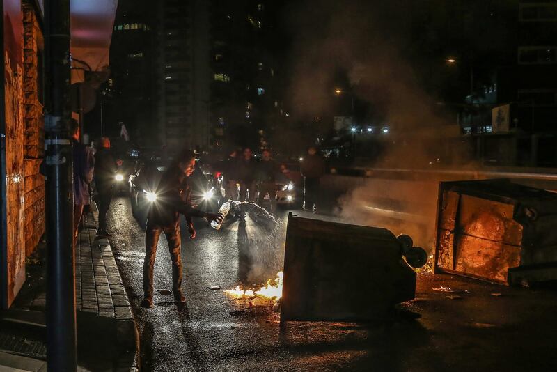 Supporters of Outgoing Prime Minister Saad Hariri close the road by burning waste during a protest against the newly appointed Lebanese Prime Minister Hassan Diab, at  Al-Barbir neighborhood in Beirut.  EPA