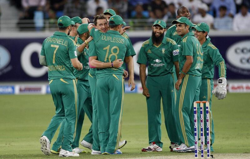 Dale Steyn, second from left, was the destroyer-in-chief as the fast bowler took three Pakistan wickets in Dubai on Wednesday. Asif Hassan / AFP