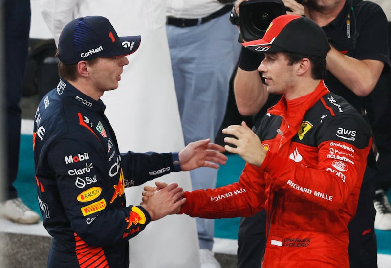 Winner Max Verstappen shakes hands with second-placed Charles Leclerc of Ferrari. Reuters