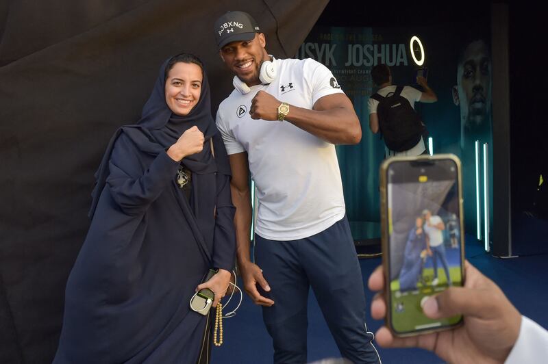 Britain's Anthony Joshua poses for a picture with a fan. AFP