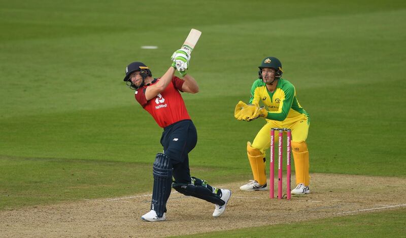 SOUTHAMPTON, ENGLAND - SEPTEMBER 06: Jos Buttler of England(L) plays a shot for six to finish the match as Alex Carey of Australia(R) looks on during the 2nd Vitality International Twenty20 match between England and Australia at The Ageas Bowl on September 06, 2020 in Southampton, England. (Photo by Gareth Copley/Getty Images for ECB)