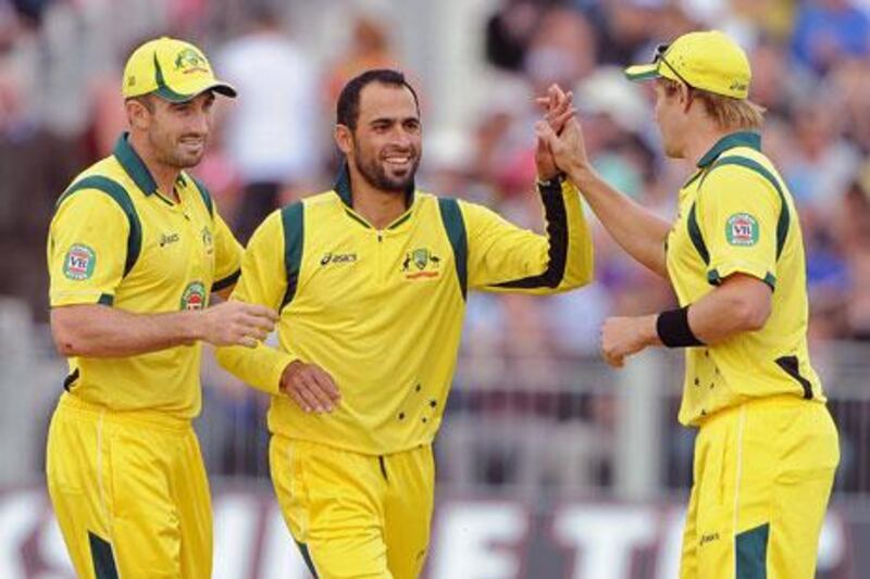 Fawad Ahmed, centre, had requested Cricket Australia that he not wear a beer logo on his shirt. Andrew Yates / AFP