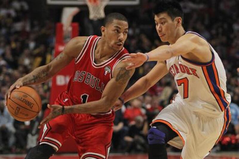 CHICAGO, IL - MARCH 12: Derrick Rose #1 of the Chicago Bulls drives past Jeremy Lin #17 of the New York Knicks at the United Center on March 12, 2012 in Chicago, Illinois. The Bulls defeated the Knicks 104-99. NOTE TO USER: User expressly acknowledges and agrees that, by downloading and or using this photograph, User is consenting to the terms and conditions of the Getty Images License Agreement.   Jonathan Daniel/Getty Images/AFP== FOR NEWSPAPERS, INTERNET, TELCOS & TELEVISION USE ONLY ==

