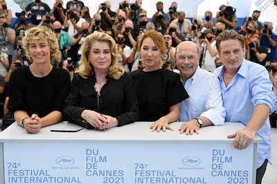 From left, Belgian actress Cecile de France, French actress Catherine Deneuve, French director Emmanuelle Bercot, Lebanese actor and doctor Gabriel Sara, and French actor Benoit Magimel pose during a photocall for the film 'De Son Vivant' (Peaceful) at the 74th Cannes Film Festival. AFP