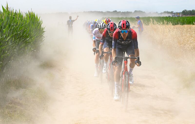 UAE Team Emirates team's Slovenian rider Tadej Pogacar (3rd R) wearing the best young rider's white jersey, Ineos Grenadiers team's British rider Geraint Thomas (2nd R) and Ineos Grenadiers team's Dutch rider Dylan Van Baarle (R) cycle across a cobblestone sector in the final kilometers of the 5th stage of the 109th edition of the Tour de France cycling race, 153,7 km between Lille and Arenberg Porte du Hainaut, in northern France. AFP