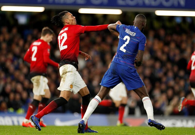 Chris Smalling, left, of Manchester United, pushes Chelsea defender Antonio Rudiger during United's 2-0 FA Cup victory at Stamford Bridge. Reuters
