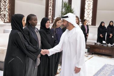 Sheikh Hamdan bin Zayed Al Nahyan, Ruler’s Representative in Al Dhafra Region (R), greets a doctor who volunteered at the Special Olympics World Games Abu Dhabi 2019, during an iftar reception at Al Bateen Palace. Hamad Al Mansouri for the Ministry of Presidential Affairs