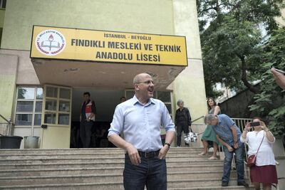 Ahmet Şık, parliamentary candidate for the Pro - Kurdish HDP party, votes in Istanbul. Photo by Shawn Carrie