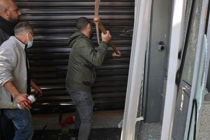 Others attempted to break into the banks. AFP