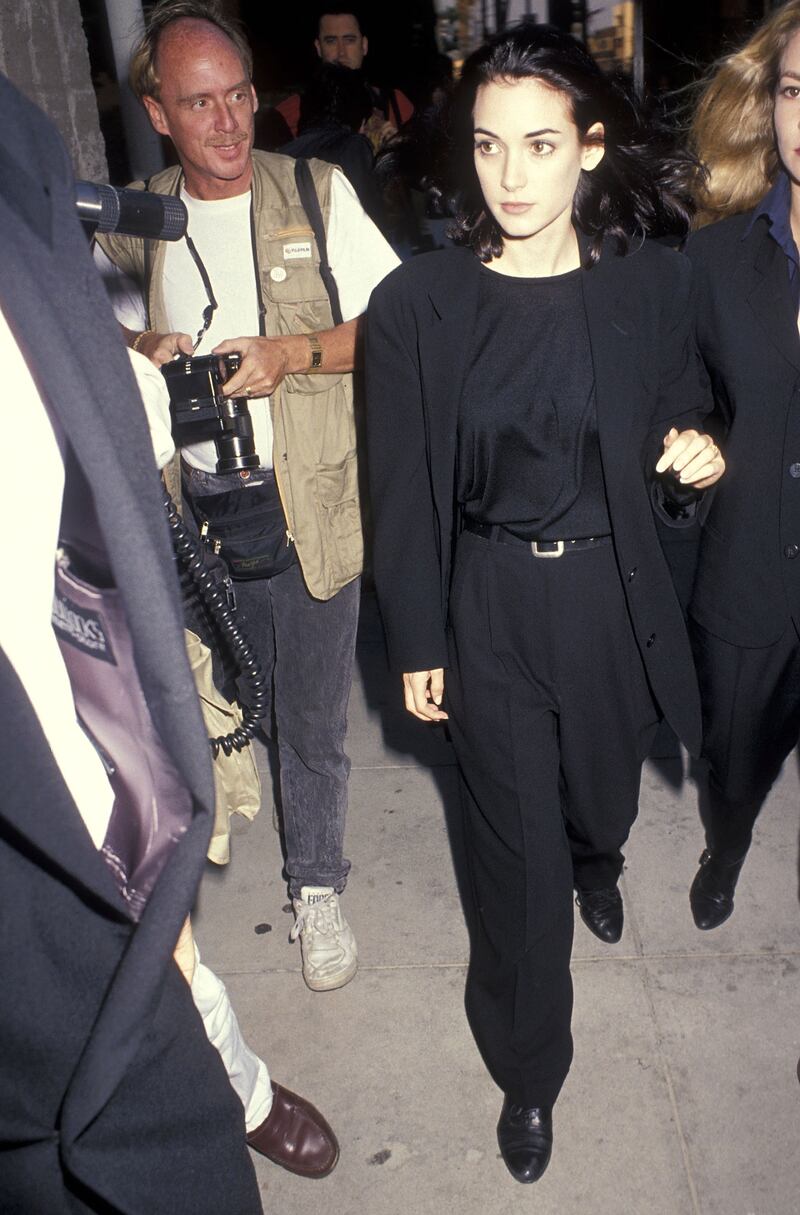 Winona Ryder in a black suit and oversized blazer attends the 'Backdraft' Beverly Hills premiere on May 22, 1991 at the Academy Theatre. Getty