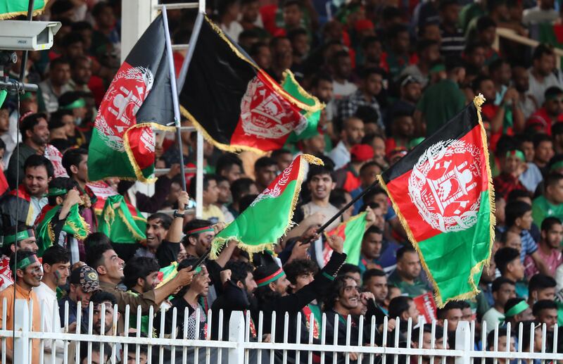 Fans during the match at Sharjah Cricket Stadium.