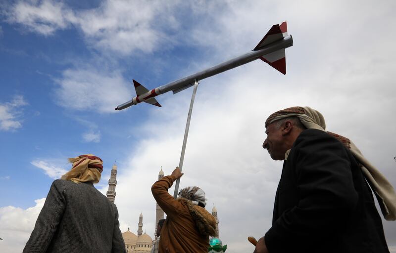 A Houthi supporter holds up a mock missile during a protest in Sanaa on March 8. Addressing threats to Red Sea shipping is just one challenge where collaborative security measures are essential. EPA
