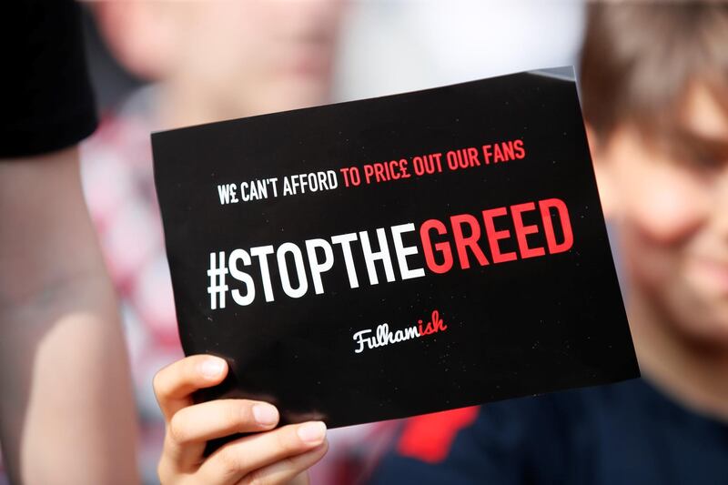 A fan holds up a sign. Reuters