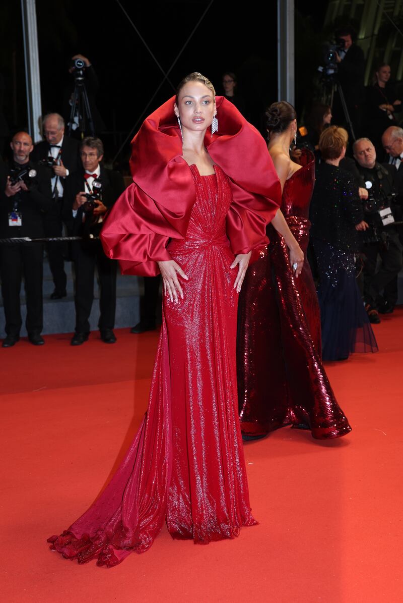 Rose Bertram opts for a hooded, beaded red gown. EPA 