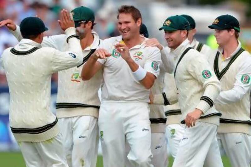 Ryan Harris, centre, took three of England's top-order wickets on Sunday. Andrew Yates / AFP