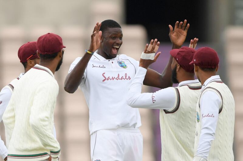 West Indies bowler Jason Holder celebrates taking the wicket of England's Jofra Archer. AFP