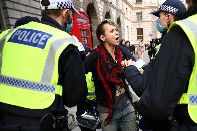 Police officers detain an anti-lockdown protestor during a demonstration amid the coronavirus disease (COVID-19) outbreak in London.  Reuters