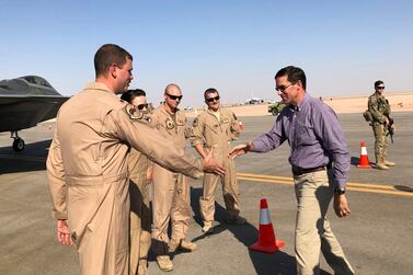 US Defence Secretary Mark Esper talks with US troops in front of an F-22 fighter jet deployed to Prince Sultan Air Base in Saudi Arabia, Tuesday, October 22, 2019. AP
