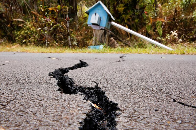 A crack is seen in a road in the Leilani Estates subdivision during ongoing eruptions of the Kilauea Volcano in Hawaii on May 13, 2018. Terray Sylvester / Reuters