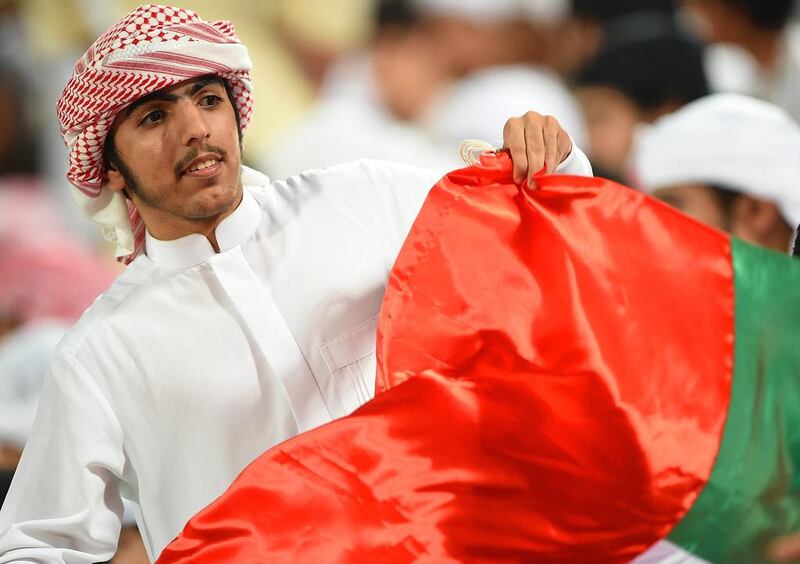 A UAE supporter celebrates during the 2018 World Cup qualifying match against Thailand. Tom Dulat / Getty Images