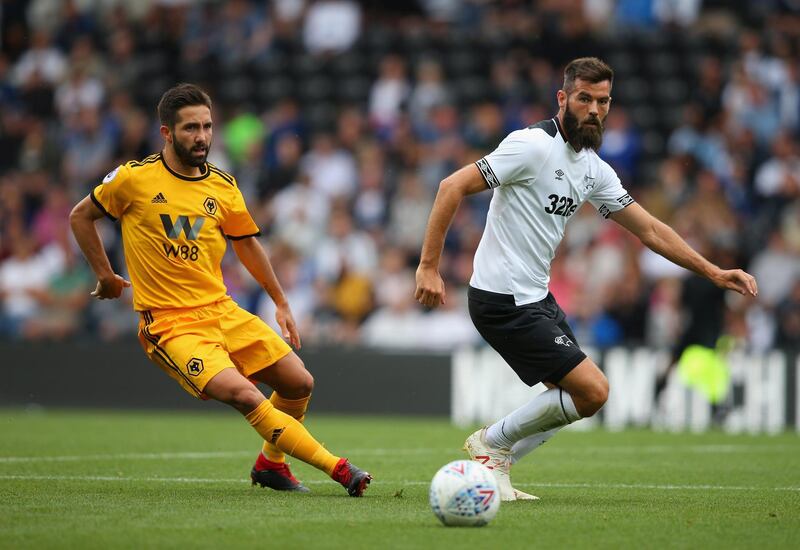 DERBY, ENGLAND - JULY 28:  Joe Ledley of Derby County passes the ball ahead of Joao Moutinho of Wolverhampton Wanderers during a pre-season friendly match between Derby County and Wolverhampton Wanderers at Pride Park on July 28, 2018 in Derby, England.  (Photo by Alex Livesey/Getty Images)