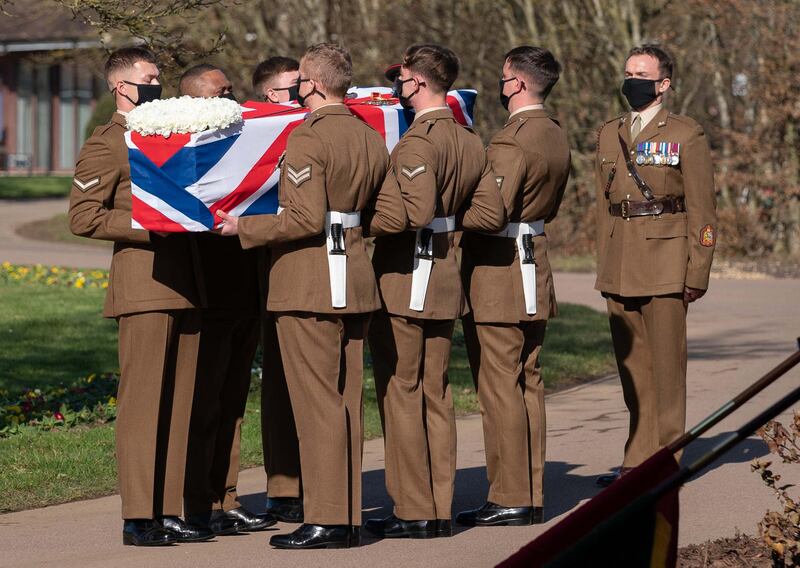 The coffin was draped in the Union flag and his Second World War medals were placed on top. AFP