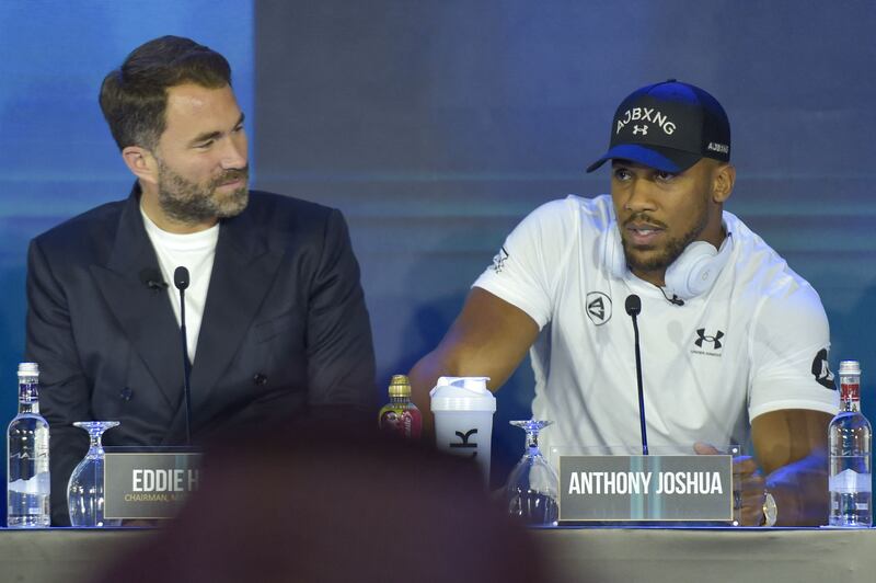 Anthony Joshua alongside Matchroom Promotions chief Eddie Hearn. AFP