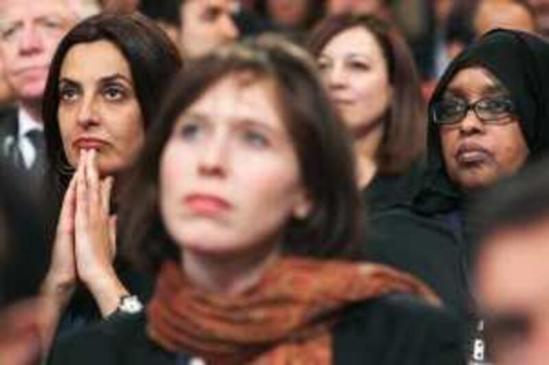 Audience members listen to U.S. President Barack Obama address the Presidential Summit on Entrepreneurship at the Ronald Reagan Building in Washington, April 26, 2010.REUTERS/Larry Downing  (UNITED STATES - Tags: POLITICS BUSINESS) *** Local Caption ***  WAS311_OBAMA-_0426_11.JPG