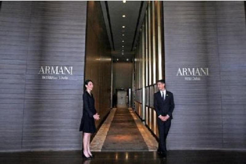 Hotel staff stand at the lobby of Armani hotel at Burj Khalifa in Dubai.