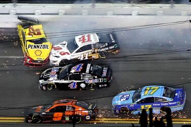 DAYTONA BEACH, FLORIDA - AUGUST 29: Jimmie Johnson, driver of the #48 Ally Chevrolet, Matt Kenseth, driver of the #42 Credit One Bank Chevrolet, Joey Logano, driver of the #22 Shell Pennzoil Ford, Cole Custer, driver of the #41 HaasTooling.com/Autodesk Ford, and Kevin Harvick, driver of the #4 Mobil 1 Ford, are involved in an on-track incident during the NASCAR Cup Series Coke Zero Sugar 400 at Daytona International Speedway on August 29, 2020 in Daytona Beach, Florida. Brian Lawdermilk/Getty Images/AFP == FOR NEWSPAPERS, INTERNET, TELCOS & TELEVISION USE ONLY ==