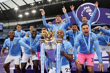 Manchester City players with the Premier League trophy. Getty