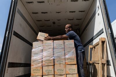 A worker loads food and other emergency supplies destined for the Gaza Strip on Saturday in Cairo. Getty Images.