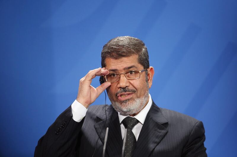 FILE - JUNE 17, 2019: According to state TV, ousted Egyptian President Mohammed Morsi has died at the age of 67 after fainting in a courtroom. BERLIN, GERMANY - JANUARY 30:  Egyptian President Mohamed Mursi speaks to the media with German Chancellor Angela Merkel (not pictured) following talks at the Chancellery on January 30, 2013 in Berlin, Germany. Mursi has come to Berlin despite the ongoing violent protests in recent days in cities across Egypt that have left at least 50 people dead. Mursi is in Berlin to seek both political and financial support from Germany.  (Photo by Sean Gallup/Getty Images)