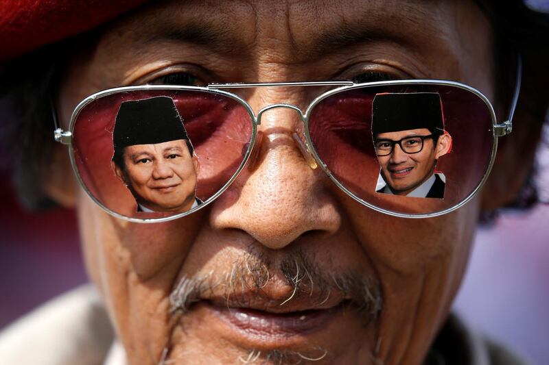 A supporter wears glasses as he attends a campaign rally of Indonesia's presidential candidate Prabowo Subianto for the upcoming general election, in Indonesia. Reuters