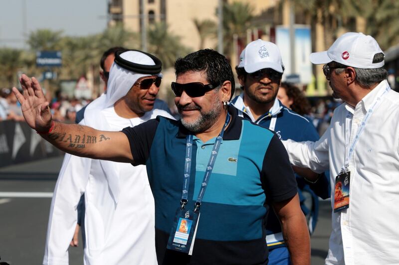Dubai, United Arab Emirates, February 8, 2014:      Diego Maradona waves to the crowd ahead of the finish of the fourth stage of the Dubai Tour cycling race in Dubai on February 8, 2014. Christopher Pike / The National

Reporter: Paul Radley
Section: Sport