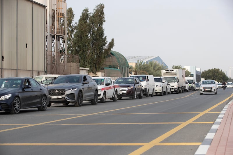 Cars queue up at the MenaLabs Covid-19 drive-through testing centre. There has been a huge increase in the number of people getting tested for the coronavirus as schools opened for the second term and new weekly testing rules for government employees in Abu Dhabi came into force.  Antonie Robertson / The National