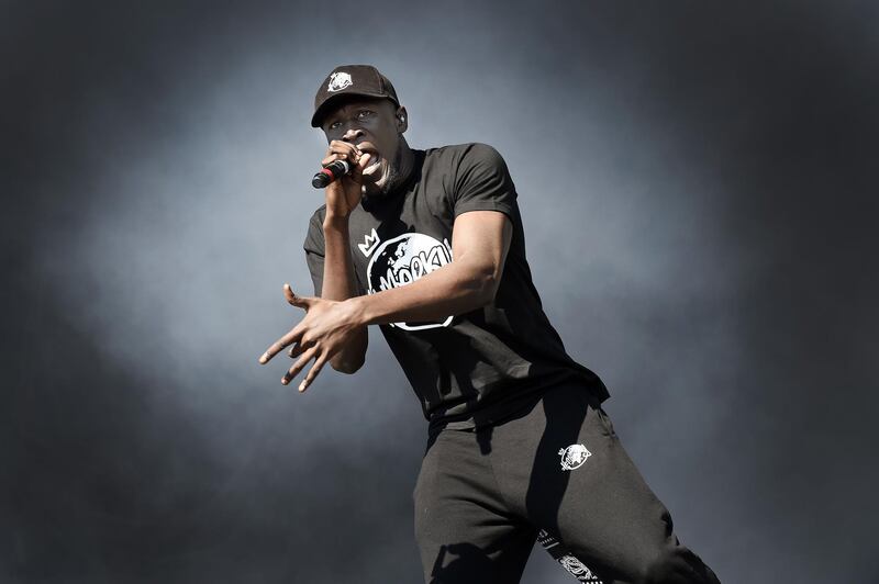 Grime artist Stormzy performs on the main stage of the second day of the TRNSMT music Festival on Glasgow Green, in Glasgow on July 8, 2017.
 / AFP PHOTO / Andy Buchanan
