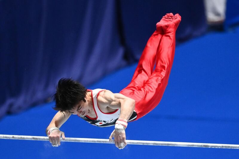Kohei Uchimura of Japan competes on the horizontal bar during the Friendship and Solidarity Competition gymnastics event in Tokyo, the first major international sporting event in the Japanese capital since the Tokyo 2020 Olympic Games was postponed due to the coronavirus pandemic.  AFP