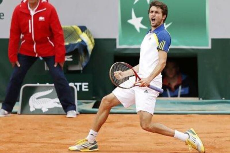 Home favourite Gilles Simon came from two sets down to beat the Australian Leyton Hewitt. Martin Bureau / AFP