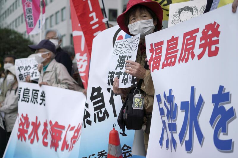 People protest against government's decision to start releasing massive amounts of treated radioactive water from the wrecked Fukushima nuclear plant into the sea, during a rally outside the prime minister's office in Tokyo. AP
