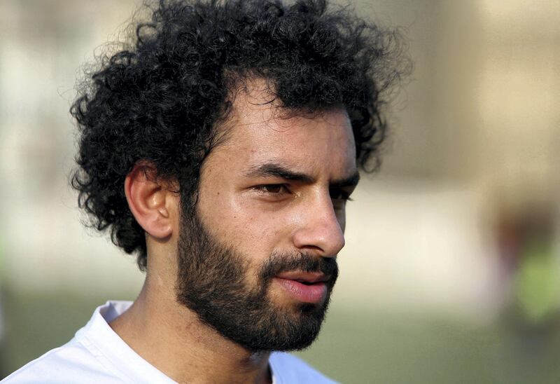 Iraqi footballer Hussein Ali, who plays for the Iraqi Al-Zawraa FC and is a lookalike of Liverpool's Egyptian forward Mohamed Salah, trains with his team in the capital Baghdad, on June 3, 2018. - With his black beard, curly hair and football shirt, Iraqi striker Hussein Ali is often mistaken for one of the world's top players: Egypt's Mohamed Salah. (Photo by SABAH ARAR / AFP)