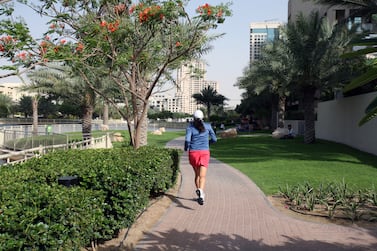 A woman jogs in Dubai. Thirty-five per cent of respondents exercise less than once a week, according to a survey by the NMC Health Index. Randi Sokoloff / The National