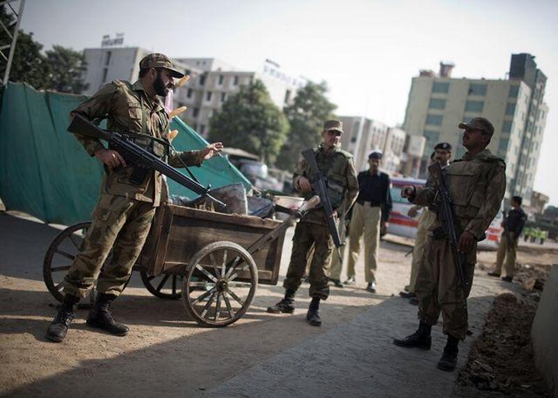 Violent crime has risen in Punjab despite the extreme measures sometimes taken by police. Above, policemen secure the site of a suicide bomb attack that killed 35 people, many of them workers queuing for their paycheques, in the Punjabi city of Rawalpindi last November. Daniel Berehulak / Getty Images